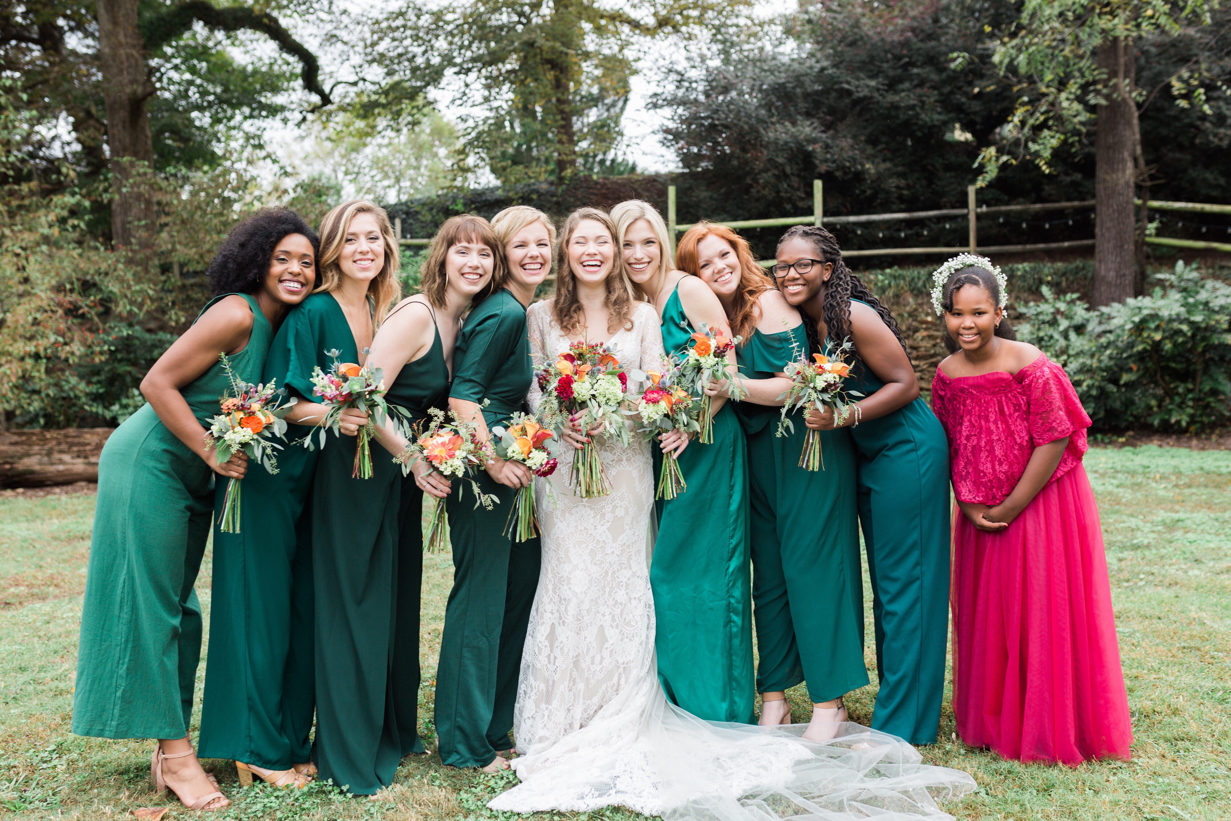 Bridesmaids in green jumpsuits